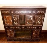 A Japanese Meji period rosewood display cupboard on stand, panels of Japanese scenery in mother of