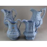 A group of early nineteenth century blue stoneware relief moulded jugs, c.1830-50. To include: a