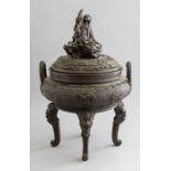A 19th Century Chinese bronze censer and cover, the domed cover with a finial cast as a smiling