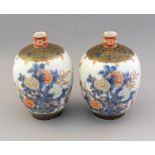A pair of Japanese imari baluster vases, Meiji period, 1868-1912, probably Fukagawa, slender