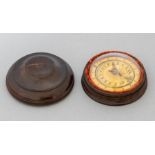 A George III Porter's Magnetic Sun Dial, dated 1824, encased in convex glass in a turned lignum