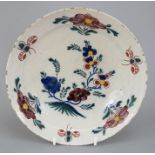 An eighteenth century hand-painted tin glazed earthenware delft plate, c.1760-80. It is decorated in