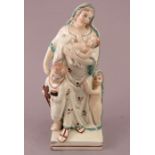 An early nineteenth century pearlware Staffordshire figure on square base, c.1820. It depicts a lady