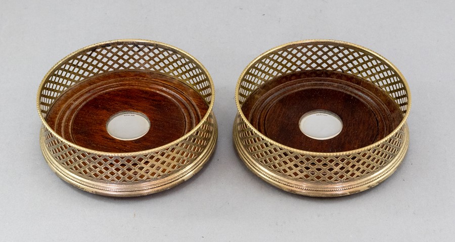 A boxed pair of Mappin & Webb silver wine coasters, pierced sides, turned wooden inserts with - Image 2 of 2