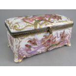 A nineteenth century porcelain lidded box on splayed feet made by Samson in the Serves style, c.