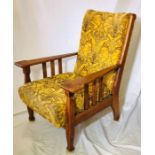 An Arts & Crafts Oak Bergere chair, Circa 1920, high scrolling top back, supported with gradual