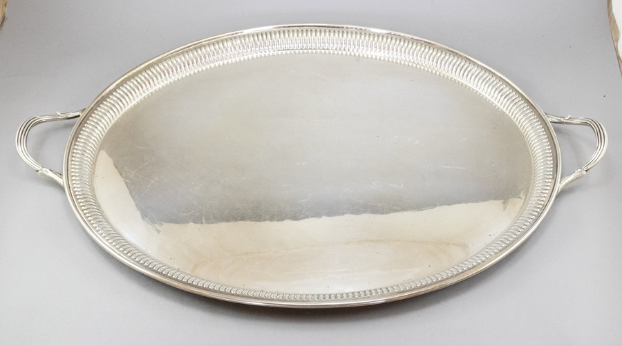 A large oval silver twin handled sideboard tray, gadroon boder, maker Barker Ellis & Co,