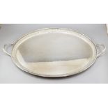 A large oval silver twin handled sideboard tray, gadroon boder, maker Barker Ellis & Co,