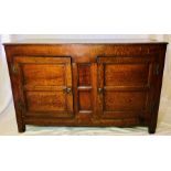 An 18th century oak livery cupboard, rectangular moulded edge top, above two moulded split panel