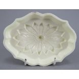 A fine late eighteenth century Wedgwood creamware jelly mould, c. 1790. It depicts a floral motif.