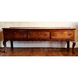 A mid 18th Century George II oak dresser base, circa 1750, rectangular top above three moulded