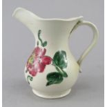 An eighteenth century Staffordshire salt glazed jug, c.1760-80. It is decorated wit floral designs