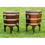A matched pair of George III mahogany brass mounted wine coolers, circa 1780, in a Hepplewhite