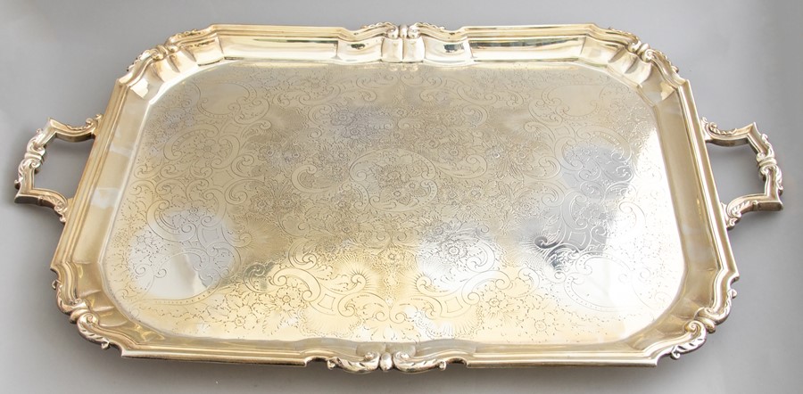 A large George V silver twin handled sideboard tray, scroll border, bright cut scroll bed, maker