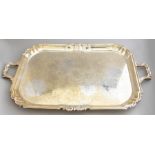 A large George V silver twin handled sideboard tray, scroll border, bright cut scroll bed, maker