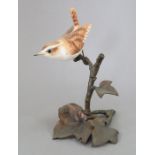 An Albany Fine China Co. ceramic bird study incorporating metal. Modelled as a Wren. Factory mark to