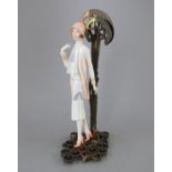 An Albany Fine China Co. model of of a lady incorporating a metal base from the 'Twenties' series.