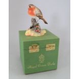 A Royal Crown Derby, Fine Bone China bird figure: Robin. Including original hard-case. Factory