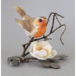 An Albany Fine China Co. ceramic bird study incorporating metal. Modelled as a Robin. Factory mark