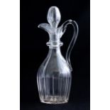 A mid 19th Century clear cut glass claret jug and stopper, circa 1850, broad fluted body, star cut