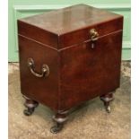 A George III mahogany cellarette, circa 1810, hinged cover with a swing brass handle, side