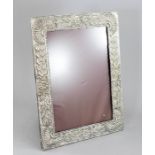 A large easel photograph frame, early 20th Century, floral repousse white metal surround, (