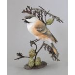 A Royal Worcester ceramic bird study incorporating metal. Modelled as a Marsh Tit. Factory mark to
