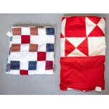 An extra large red and white bedspread in white cotton with a red patchwork in squares and