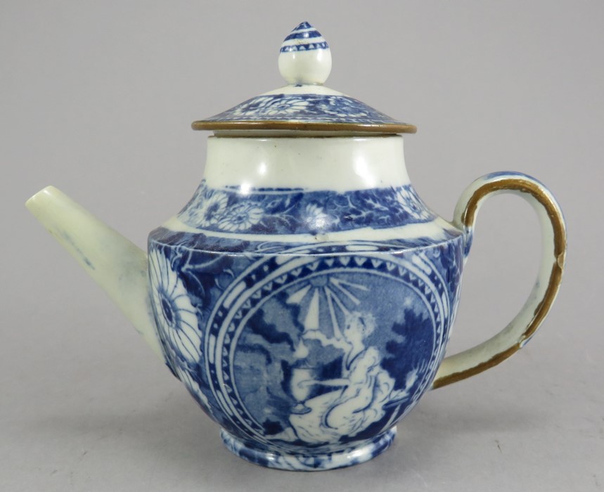 An early nineteenth century commemorative blue and white transfer-printed moulded child's teapot and