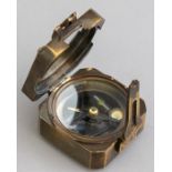 A metal field pocket compass, marked Kelvin & Hughes and bearing date 1917, width 5.5cm Condition: