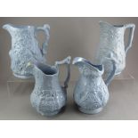 A group of early nineteenth century blue stoneware relief moulded jugs, c.1830-50. To include: a