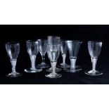 A group of 18th Century and later glass wines, most with double opaque twist stems, height of