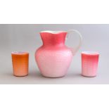 A late 19th Century ruby cased satin glass pitcher, circa 1880, clear pincered handle, ground