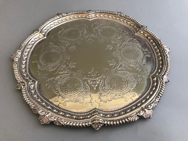 A Victorian plated salver with floral and scroll engraving