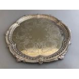 A Victorian plated salver with floral and scroll engraving