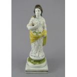An early nineteenth century Staffordshire pearlware figure of Pomona on a square base, c.1810-20.