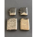 Four various silver vesta cases, one plain, three engraved (4)