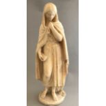 A 20th Century Italian alabaster statue of The Virgin Mary, standing wearing a cloak and holding a