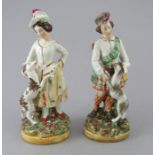 A pair of nineteenth century William Kent Staffordshire figures, c.1880-1900. They depict a man