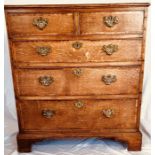 A George III oak and mahogany crossbanded chest of drawers, circa 1780, rectangular moulded edge,