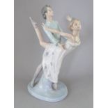 A Nao by Ladro figure of a dancing couple. Factory mark to base. 33 cm tall. (1) Condition: In