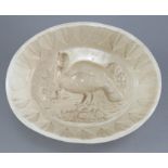 An early nineteenth century Wedgwood creamware jelly mould, c. 1820. It depicts a turkey in a
