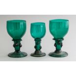 A pair of 19th Century green glass roemers, folded ribbed feet, height 13.5cm and a smaller