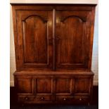 An early George III welsh oak livery cupboard, circa 1760, moulded cornice above two moulded arch