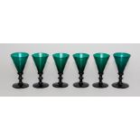 A set of six 19th Century green glass wines, conical bowls, knopped stems, broken pontils, height
