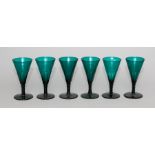A set of six 19th Century green glass wines, conical facet cut bowls, facet cut stems, ground