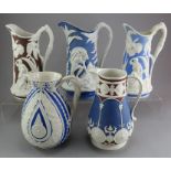 A group of early nineteenth century stoneware relief moulded jugs, c.1830-50. To include: two T &