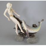 An Albany Fine China Co. model of a female swimming with a seal incorporating a metal and glass base