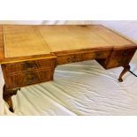 A George III revival mahogany cross banded partners desk, inverted breakfront, leather inlay,