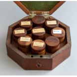 A George III mahogany spice box, circa 1820, barbers pole strung and of octagonal form with a hinged